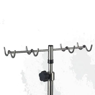 Metal pot rack with hooks on a white background