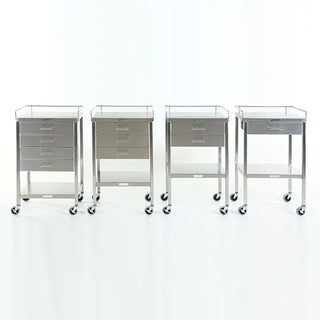 Four medical MidCentral Utility Tables with drawers on wheels against a white background