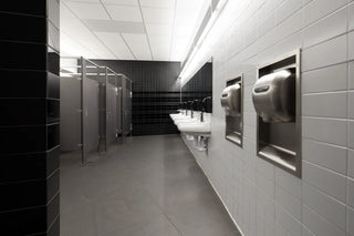 Brushed stainless steel Excel Dryer XL-SB hand dryer featuring touchless automatic operation, high-speed drying performance, and a surface-mounted design for commercial restroom environments.
