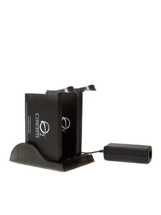 O2 Concepts dual bay battery charger holding two compatible Oxlife Independence batteries for simultaneous charging.