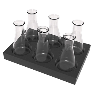 Set of glass beakers on a black tray against a white background
