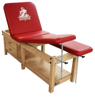 Red Pivotal Health 6 Leg Edge Sport Wood Treatment Table with wooden base on a white background