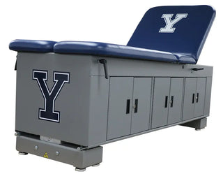 Gray Pivotal Health ET Treatment Cabinet with blue cushion and 'Y' logo on a white background