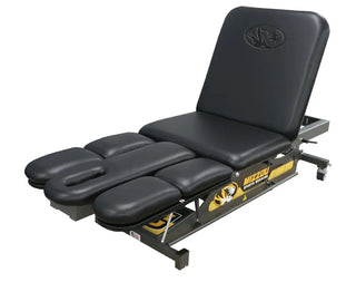 Black Pivotal Health PT9060-650 Leg & Shoulder Therapy Table with adjustable sections on a white background