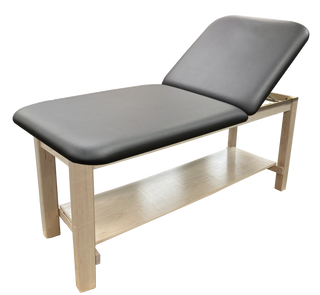 Pivotal Health Premium Wood Treatment Table with black cushioned surface and wooden frame on a white background