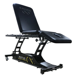 Black Pivotal Health THERA-P™ Electric Treatment Table with 'Motus' branding on a white background
