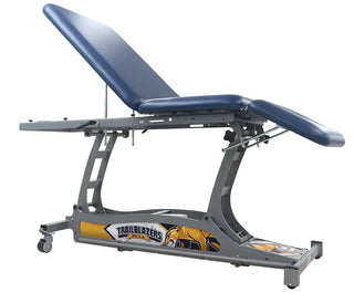 Pivotal Health THERA-P™ Electric Treatment Table with 'Trailblazers' branding on a white background