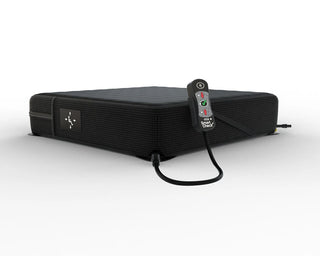 Black ROHO® HIGH PROFILE® Single Compartment Sensor Ready® Wheelchair Cushion with remote control on a white background