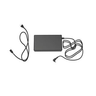 Black Rhythm Healthcare TOC3 AC Power Supply with two cables on a white background
