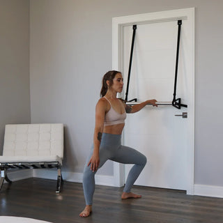 The Stroops DORBARRE is a compact portable aluminum barre secured to a standard doorframe with synthetic brackets and adjustable straps. The barre has supports at four ends and can be positioned at different heights for home ballet, barre, yoga, and Pilates exercises.