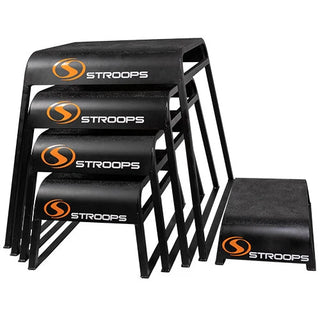 Stroops Ergo Plyo Boxes are black stackable plyometric training boxes with rounded edges, smooth ski-like legs, and non-slip top surfaces, available in five heights from 6 to 30 inches.