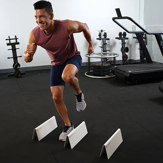 White Stroops agility hurdles made from durable whiteboard-like material, designed for speed and agility drills, workout space marking, and circuit training.