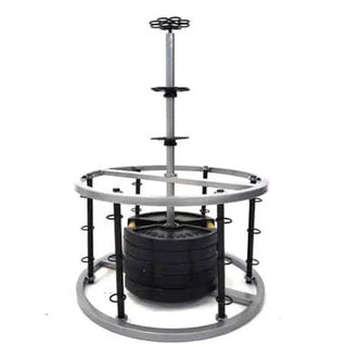 The Stroops REVOL Revolution Anchor is a circular black group fitness resistance system with six vertical pillars arranged around a central swiveling anchor structure. Multiple anchor points are positioned at different heights around the system for attaching resistance bands and supporting movement-based group training.