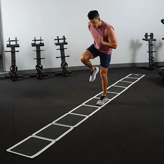 The Stroops ROL Roll Out Ladder is a long black rubber agility mat with white borders and rectangular footwork sections, designed for portable speed, agility, and quickness training.