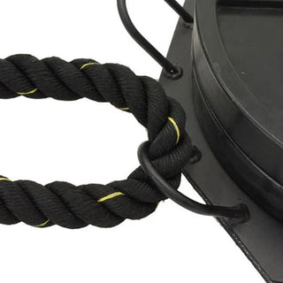 The Stroops SRPBASE Portable Base is a low-profile black octagonal steel ground anchor with eight evenly positioned connection points around its perimeter and a central area for adding weight plates. Its compact design is intended for portable group resistance training and floor-based exercises.