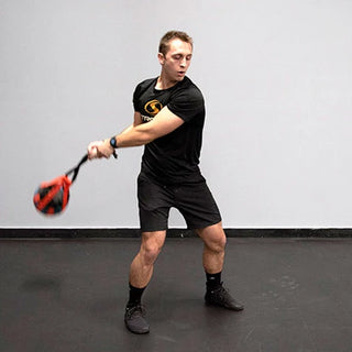 The Stroops TOMSACK Tomahawk Sack is a compact medicine ball holder with adjustable handle length options and a knotted handle end, designed for rotational exercises with a 10-inch medicine ball.
