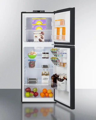 Open Summit BKRF1087B 24" Wide Wide Break Room Refrigerator-Freezer with various food items inside on a white background