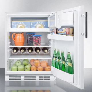 Open Summit CT661WADA 24" Wide Refrigerator-Freezer with food items including bottles, fruits, and vegetables.