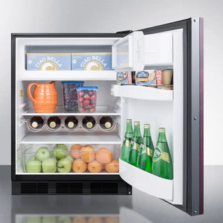 Open Summit CT663BKIFADA 24" Wide Refrigerator-Freezer with food items including bottles, fruits, and vegetables on a white background