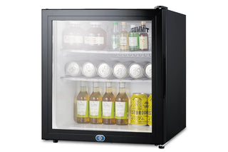 Summit MB43GL glass door minibar stocked with bottled drinks
