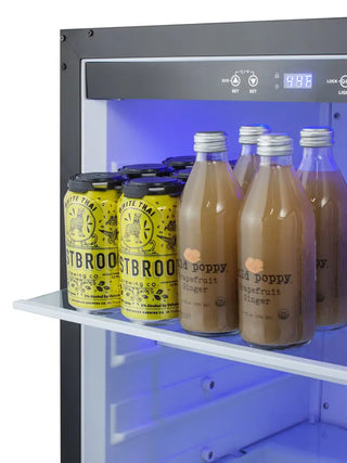 Close-up view of the Summit SPR623OSCSS beverage refrigerator interior featuring the digital temperature control panel, blue LED lighting, and beverage storage shelf.