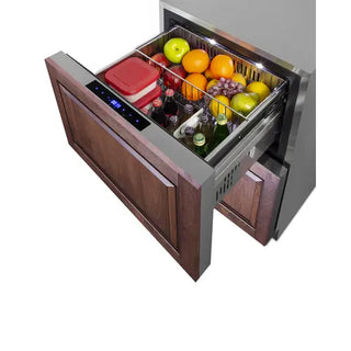 Summit SPRF34D7 refrigerated drawer with custom wood panel front, shown open and loaded with beverages, fruit, and food containers in divided storage baskets.