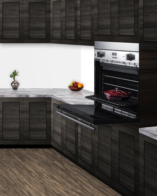 Summit TKWO27 filler trim with a wall oven in a dark wood kitchen