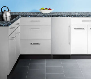 Summit BIM44G 15-inch built-in clear icemaker installed in cabinet setting on a white background