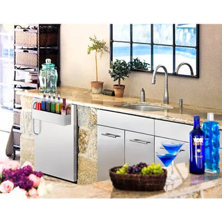 Summit SPR7BOSSTSR built-in refrigerator installed in an outdoor kitchen island beside a sink and countertop.