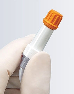 Small SwabPak® 804075_CS Disinfecting Cap with an orange cap held by a hand against a light gray background