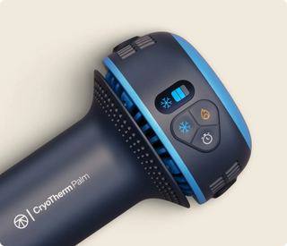 Close-up of the control buttons and branded body of the Therabody CryoTherm Palm
