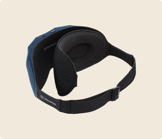 Therabody SleepMask seen at an angle with its adjustable strap extended