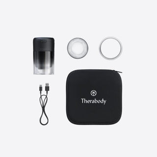 Kit layout showing the Therabody TheraCup with its cups, charging cable and carrying pouch