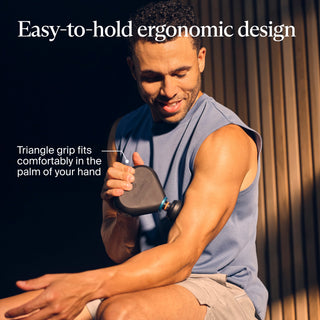 Man holding the Therabody Theragun Mini Plus in his palm in an ergonomic grip graphic