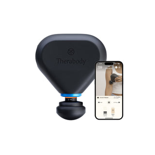 Therabody Theragun Mini Plus beside a phone running the Therabody app