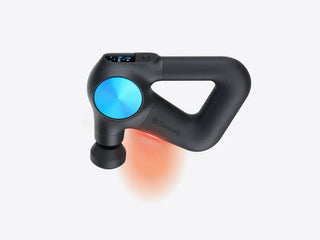 Therabody Theragun PRO Plus massage gun with the heated attachment glowing warm