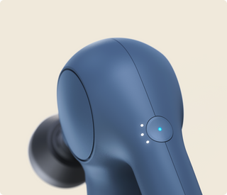 Close-up of the head and power button on the navy Therabody Theragun Relief