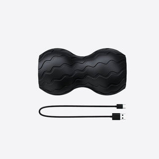 Therabody WaveDuo shown with the charging cable that ships with it