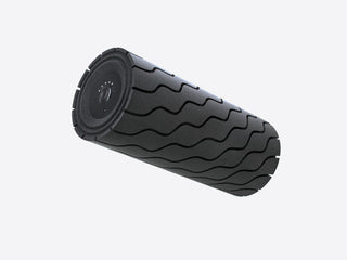 Angled view of the black Therabody WaveRoller showing its wave textured surface