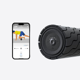 Phone running a Therabody app routine beside the control end of the WaveRoller
