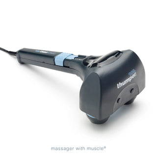 Thumper Mini Pro professional handheld percussion massager in dark gray and blue with an ergonomic long handle.