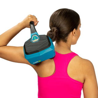 Thumper Lithium2 cordless percussion massager in black and teal with rechargeable battery and charging nest.