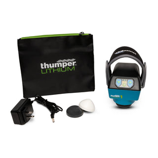 Thumper Lithium1 cordless percussion massager with a wearable glove-style hand strap in black and teal.