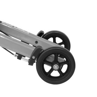 Grey Triumph Mobility Mini rollator walker with a lightweight aluminum frame, large padded seat, adjustable padded backrest, ergonomic handgrips, and four 6-inch wheels designed for indoor mobility.
