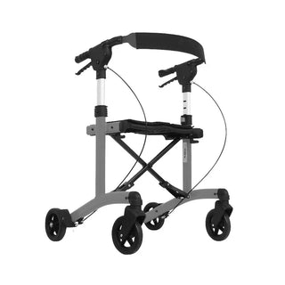 Grey Triumph Mobility Mini rollator walker with a lightweight aluminum frame, large padded seat, adjustable padded backrest, ergonomic handgrips, and four 6-inch wheels designed for indoor mobility.