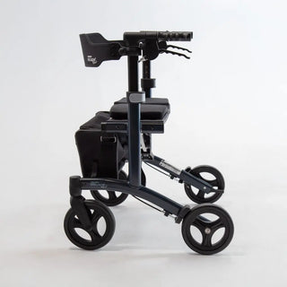Triumph Mobility Escape HD heavy-duty rollator with an aluminum frame, extra-wide padded seat, adjustable padded backrest, four large wheels, ergonomic handgrips, and a large fabric shopping bag beneath the seat.