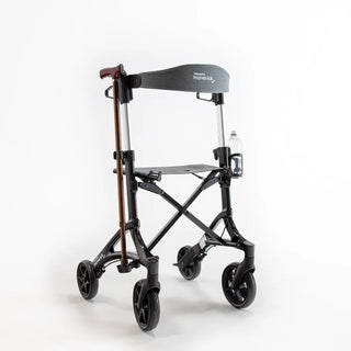 Black carbon fibre Triumph Mobility Maverick rollator walker with a padded seat, backstrap, ergonomic handgrips, integrated shopping bag, cup holder, cane holder, and large front wheels.