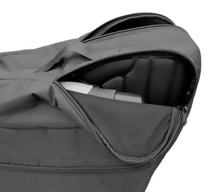 Black padded travel cover for the Triumph Prestige rollator with two front zippered storage pockets, securing buckles, a lifting handle strap, and zipper openings for handle access.