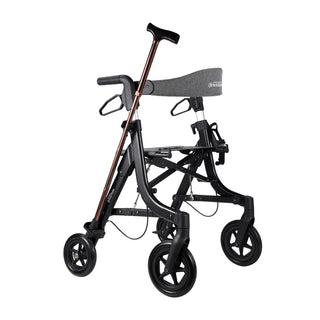 Black Triumph Essentials Compact Rollator with a lightweight folding frame, padded seat, backrest, shopping bag, adjustable handles, 8-inch front wheels, 7-inch rear wheels, cane holder, and cup holder.