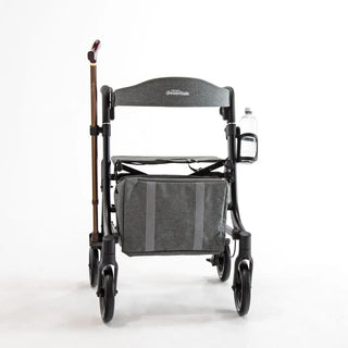 Black Triumph Essentials Compact Rollator with a lightweight folding frame, padded seat, backrest, shopping bag, adjustable handles, 8-inch front wheels, 7-inch rear wheels, cane holder, and cup holder.